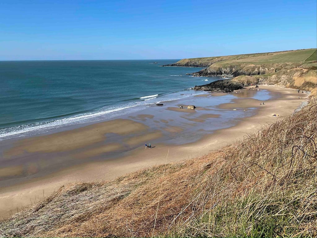 Soft sandy beach at the Whistling Sands where you can hear the sand whistles as you shuffle your feet