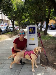 Camino dog and Mommy at the KM100 mojon in Lugo