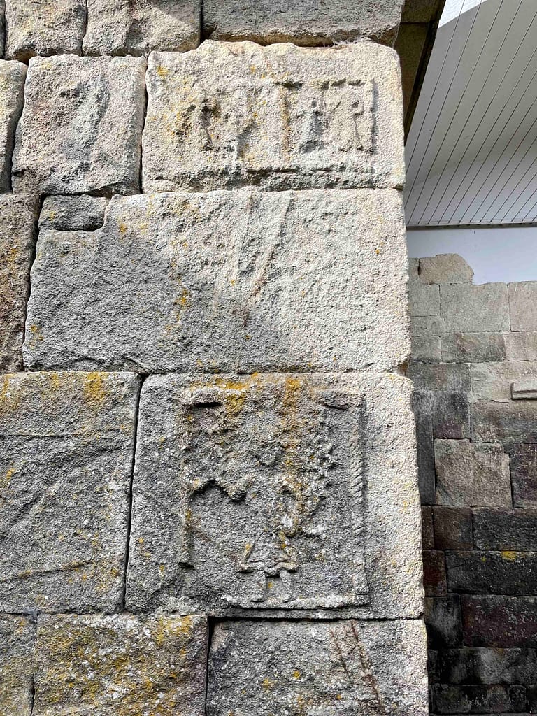 (paired) fertility related carvings on the exterior wall of the temple - male